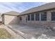 Brick house exterior with sunroom and patio at 9048 N Watson Meadows Ln, Mooresville, IN 46158