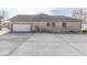 Brick house exterior with attached garage and large driveway at 9048 N Watson Meadows Ln, Mooresville, IN 46158