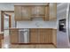 Kitchen boasts stainless steel dishwasher and ample wood cabinets at 9048 N Watson Meadows Ln, Mooresville, IN 46158