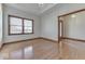 Home office with hardwood floors and built-in shelving at 9048 N Watson Meadows Ln, Mooresville, IN 46158