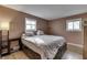 Bedroom with double bed, dresser, and light brown walls at 92 Village Rd, Bargersville, IN 46106