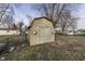 Tan wooden shed with double doors in backyard at 92 Village Rd, Bargersville, IN 46106