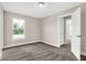 Bright bedroom with a large window and neutral walls at 1014 Stonehaven Dr, Indianapolis, IN 46239
