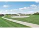 Peaceful pond with walking path and homes in the background at 1014 Stonehaven Dr, Indianapolis, IN 46239