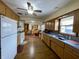 Kitchen with wood cabinets, blue countertops, and hardwood floor at 112 S Coventry Dr, Anderson, IN 46012