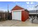 Detached red brick garage with a white automatic door and ample space at 1246 N Downey Ave, Indianapolis, IN 46219