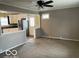 Spacious living room with carpet and view into kitchen at 1610 Douglas Ln, Lebanon, IN 46052