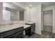 Bathroom with double vanity, marble countertop, and a large mirror at 1875 Black Oak Dr, Shelbyville, IN 46176