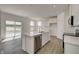 Modern kitchen with island, stainless steel appliances, and white cabinets at 1875 Black Oak Dr, Shelbyville, IN 46176