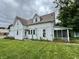 Two-story house with white siding and screened porch at 19 N Ritter Ave, Indianapolis, IN 46219