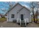 Back exterior of the home with a gravel driveway and an AC unit at 2709 Station St, Indianapolis, IN 46218