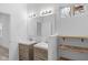 Modern bathroom with double vanity, open shelving, and wood-look flooring at 2709 Station St, Indianapolis, IN 46218