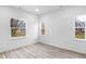 Bright bedroom with large windows and wood-look flooring at 2709 Station St, Indianapolis, IN 46218