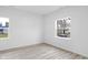Empty bedroom with wood-look flooring and large window at 2709 Station St, Indianapolis, IN 46218
