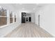 Bright and open living room with light wood-look flooring and view of the kitchen at 2709 Station St, Indianapolis, IN 46218