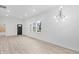 Open and spacious living area with large windows and modern light fixture at 2709 Station St, Indianapolis, IN 46218