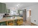 Modern kitchen with light green cabinets and stainless steel appliances at 2719 13Th St, Columbus, IN 47201