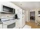 Modern kitchen with stainless steel appliances and white cabinetry at 397 Camellia Ln, Bargersville, IN 46106