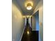 Long hallway with dark hardwood floors and light walls at 4000 N Meridian St # 2H, Indianapolis, IN 46208