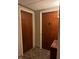 Apartment hallway with two apartment doors and carpeted floor at 4000 N Meridian St # 2H, Indianapolis, IN 46208
