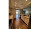 Modern kitchen with light wood cabinets and dark hardwood floors at 4000 N Meridian St # 2H, Indianapolis, IN 46208