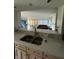 Kitchen with double sink and view to living room at 4000 N Meridian St # 2H, Indianapolis, IN 46208