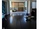 Living room with hardwood floors and balcony access at 4000 N Meridian St # 2H, Indianapolis, IN 46208
