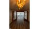 Bright living room with hardwood floors and chandelier at 4000 N Meridian St # 2H, Indianapolis, IN 46208