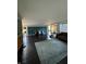 Living room with dark hardwood floors and accent wall at 4000 N Meridian St # 2H, Indianapolis, IN 46208