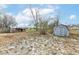 Backyard with sheds and wooden fence at 4925 W Raymond St, Indianapolis, IN 46241