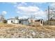 Backyard view of house with detached garage at 4925 W Raymond St, Indianapolis, IN 46241