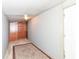 Small bedroom with wood closet and patterned rug at 4925 W Raymond St, Indianapolis, IN 46241