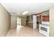 Simple kitchen with green cabinets and white appliances at 4925 W Raymond St, Indianapolis, IN 46241