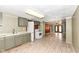 Kitchen with green cabinets and view into living area at 4925 W Raymond St, Indianapolis, IN 46241