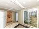 Laundry/storage room with sliding glass door to backyard at 4925 W Raymond St, Indianapolis, IN 46241