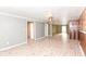 Living room with laminate flooring and access to other rooms at 4925 W Raymond St, Indianapolis, IN 46241