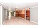 Spacious living room with wood-paneled accent wall and ceiling fan at 4925 W Raymond St, Indianapolis, IN 46241