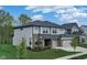 Two-story house with gray siding, brick accents, and a three-car garage at 5264 Veranda Dr, Noblesville, IN 46062