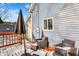 Backyard deck with seating and umbrella open on light snow at 593 Walnut St, Noblesville, IN 46060