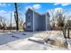 Side view of a blue two-story home with a fenced backyard at 593 Walnut St, Noblesville, IN 46060