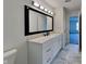 Modern bathroom with white vanity, marble-look tile floor, and contemporary fixtures at 6110 Prairie Stream Way, Columbus, IN 47203