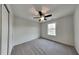 Bedroom featuring neutral walls, plush carpet, and ceiling fan at 6110 Prairie Stream Way, Columbus, IN 47203