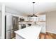 Modern kitchen with white cabinets, large island, and stainless steel appliances at 615 Sun Catcher Dr, Avon, IN 46123