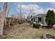 Large backyard with a wooden fence and fire pit at 6348 Kingsley Dr, Indianapolis, IN 46220
