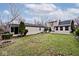 Spacious backyard with a firepit and detached garage at 6348 Kingsley Dr, Indianapolis, IN 46220
