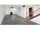 Finished basement featuring gray vinyl flooring and a wood-burning stove at 6348 Kingsley Dr, Indianapolis, IN 46220