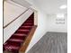 Basement with carpeted stairs and neutral-toned vinyl flooring at 6348 Kingsley Dr, Indianapolis, IN 46220
