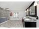 Bathroom boasts double vanity, large shower, and tiled floors at 6348 Kingsley Dr, Indianapolis, IN 46220