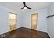 Bedroom with hardwood floors and floral curtains at 6348 Kingsley Dr, Indianapolis, IN 46220