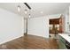 Kitchen dining area with hardwood floors and access to a sunroom at 6348 Kingsley Dr, Indianapolis, IN 46220